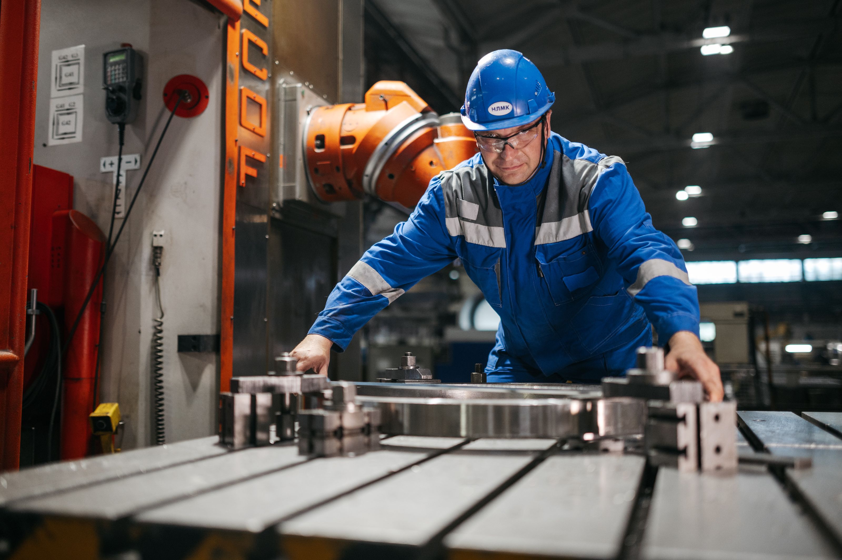 A technician working on production machinery