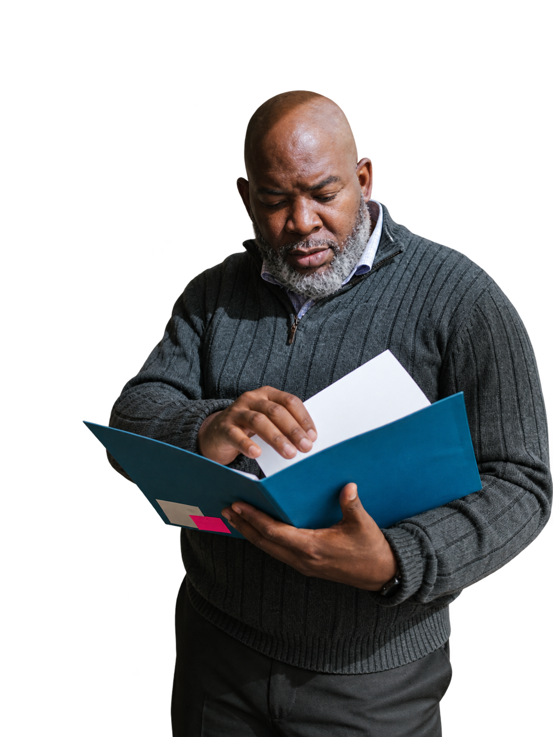 A man working through an open folder