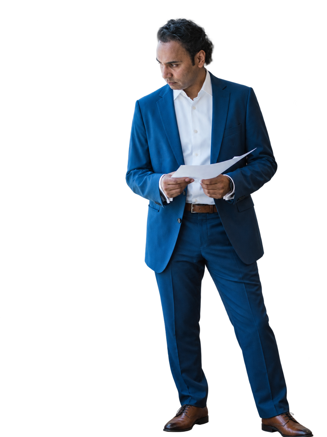 A man reading through a printed document