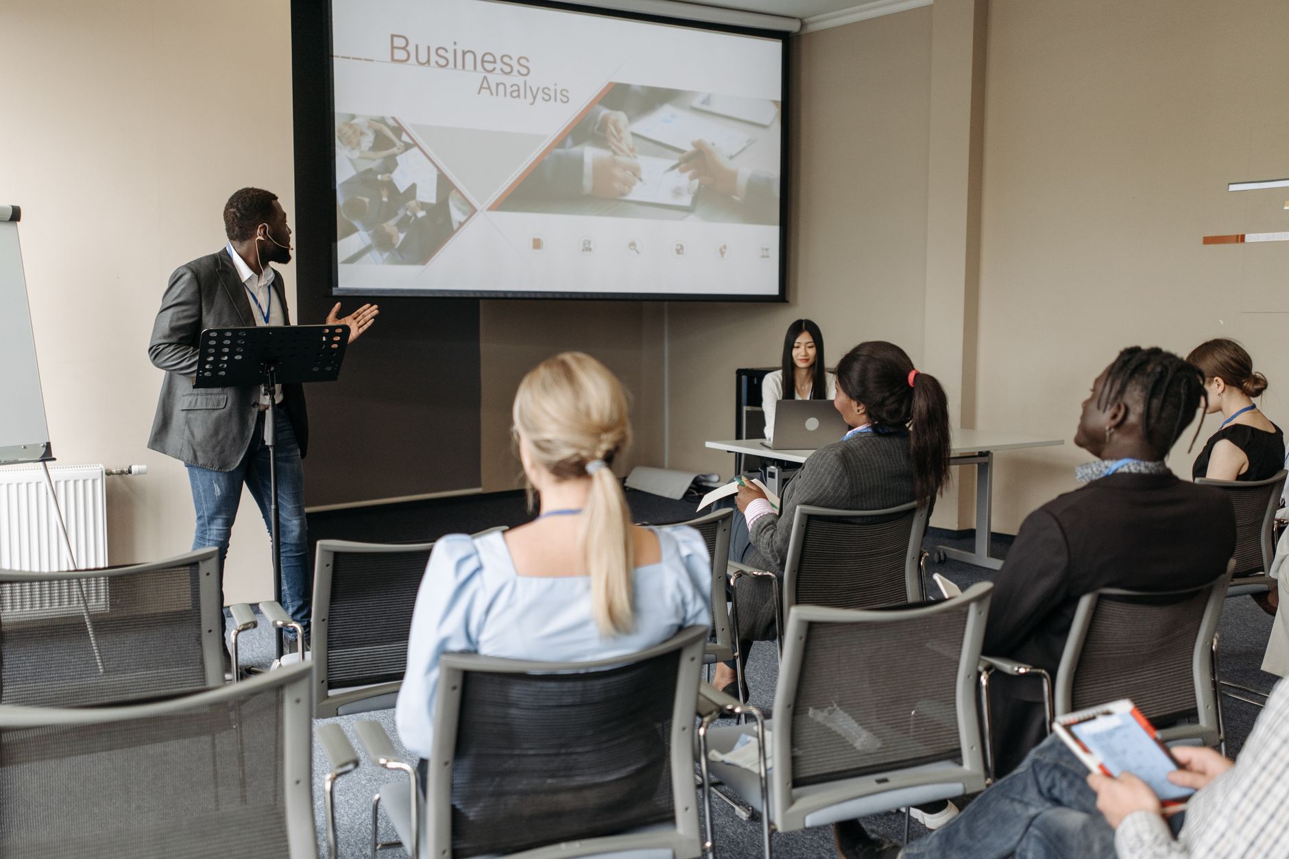 A presentation being given to a seated group