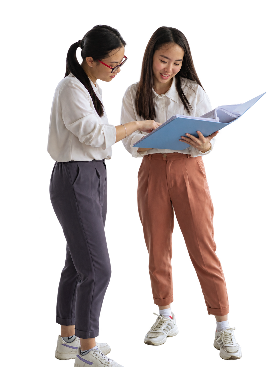 Two colleagues reviewing an open folder
